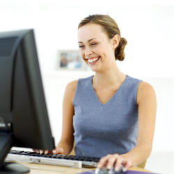  Photo of happy girl editing her web page.
